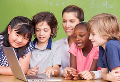 students looking on laptop